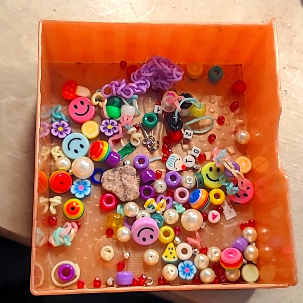 Bunch of bracelet beads and charms.